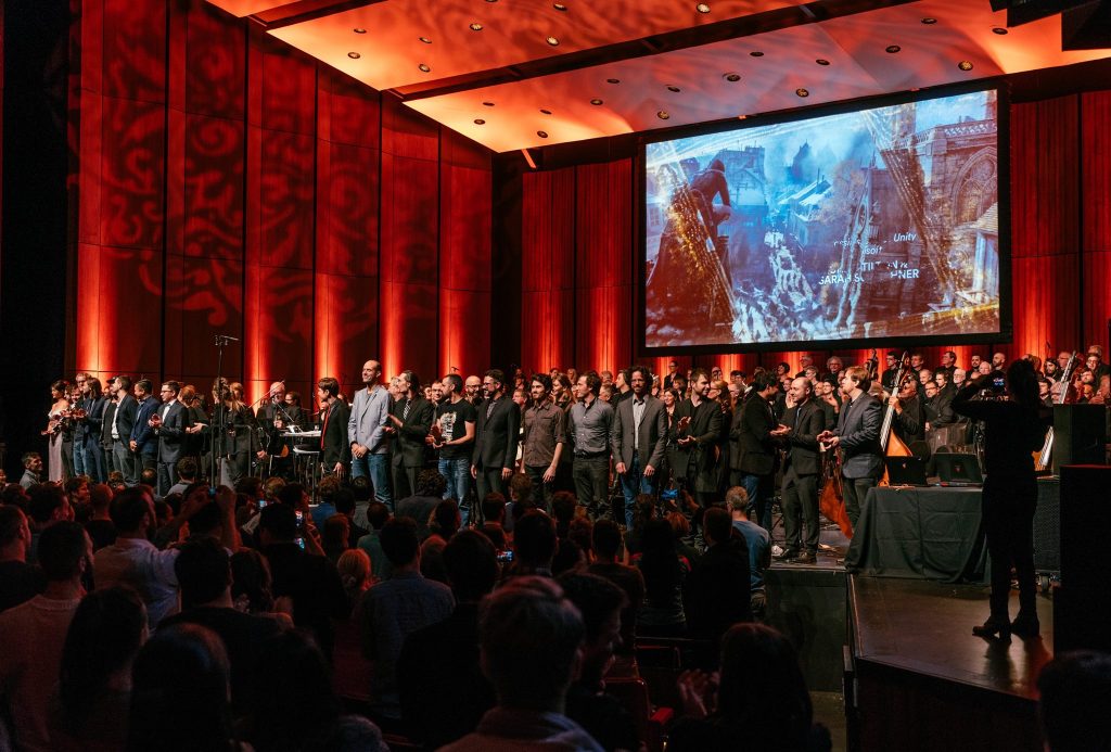 Maxime Goulet and Montreal video game composers with the Orchestre Métropolitain and conductor Dina Gilbert, for the Montreal Video Game Symphony concert, during the Montreal 375th anniversary celebrations, in Montréal, in 2017. Photo: François Goupil