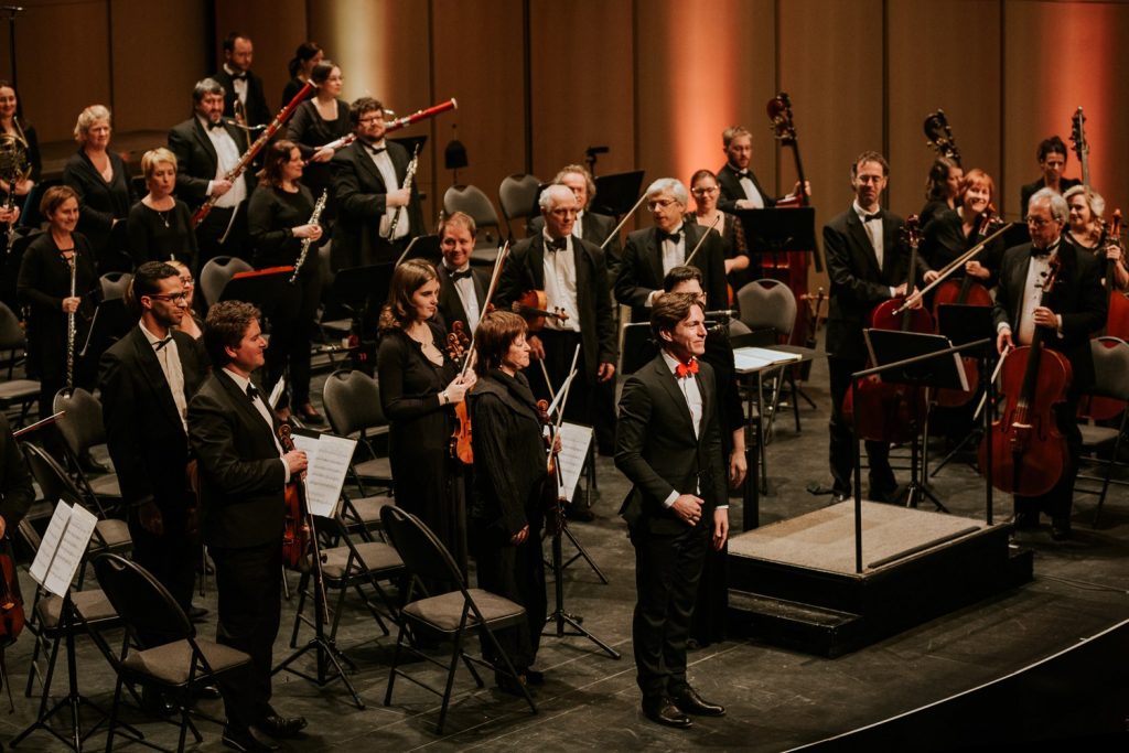 Maxime Goulet with the Orchestre Symphonique Du Saguenay Lac St-Jean and maestra Geneviève Leclair, for the performance of his composition Symphonic Chocolates. Photo by Nadia Zheng, 2016