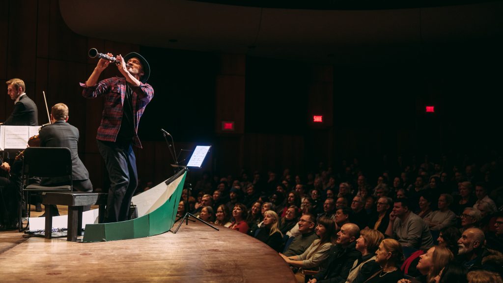 Kornel Wolak and the Orchestre classique de Montréal, during the performance of Fishing Story, at Salle Pierre-Mercure, in Montreal, on March 12, 2026. Photo by Tam Photography.